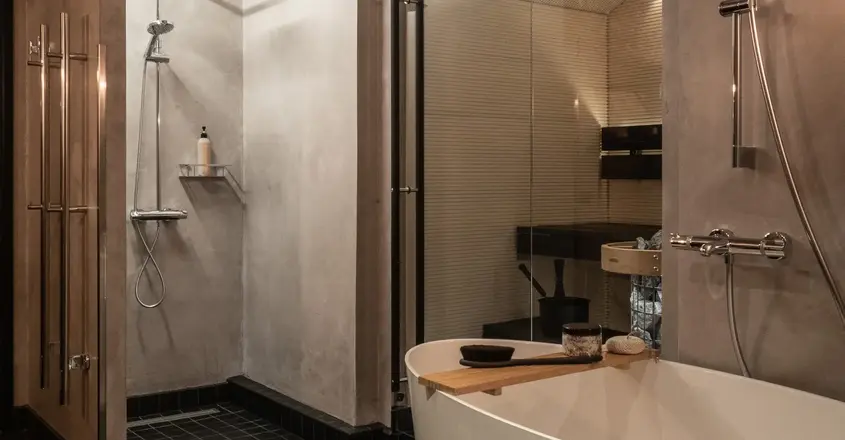 a bathroom with a shower and tub