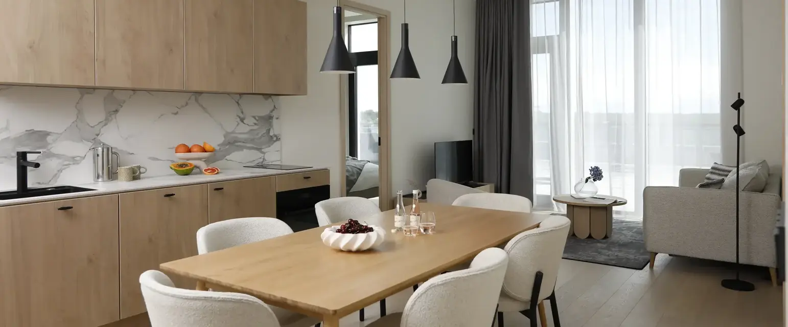 a dining room with a table and chairs