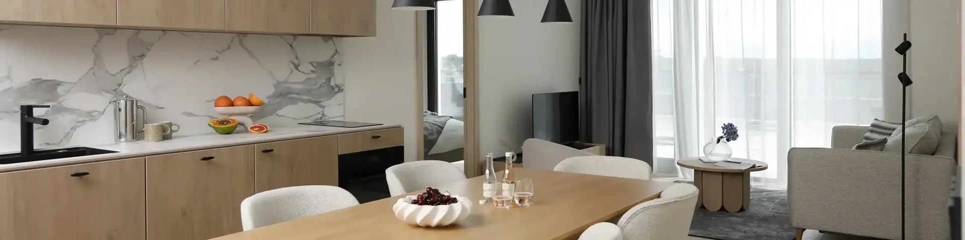 a dining room with a table and chairs