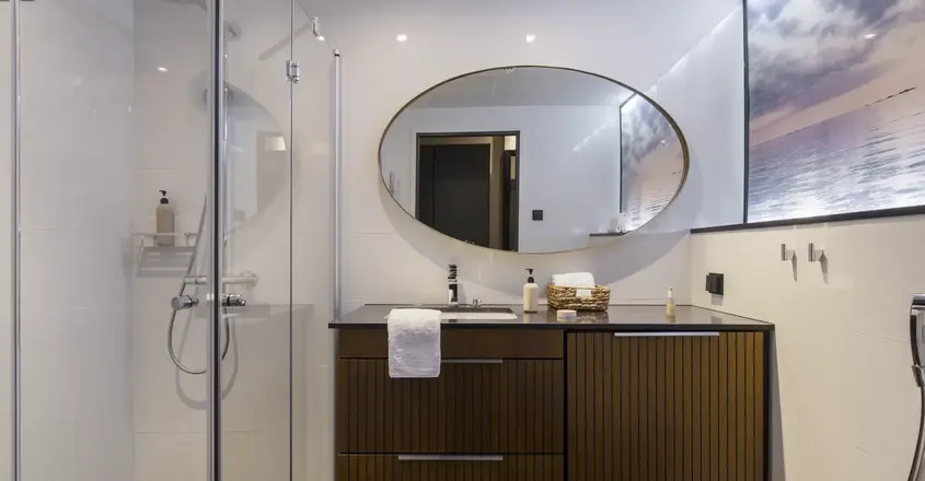 a bathroom with a mirror and a sink