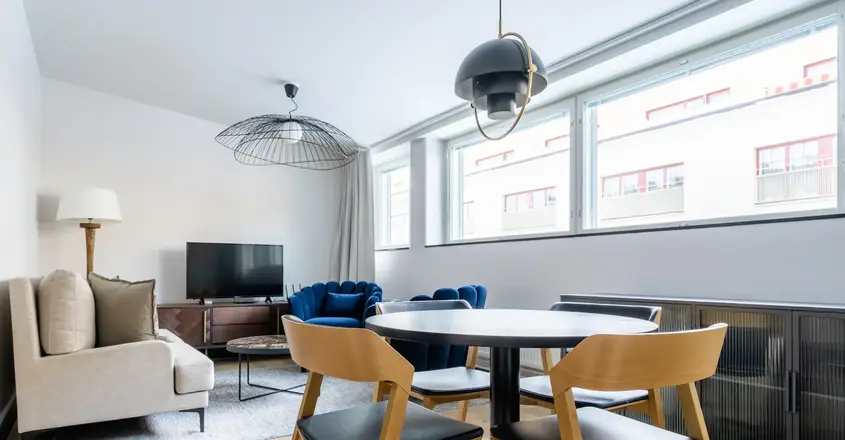 a room with a table and chairs