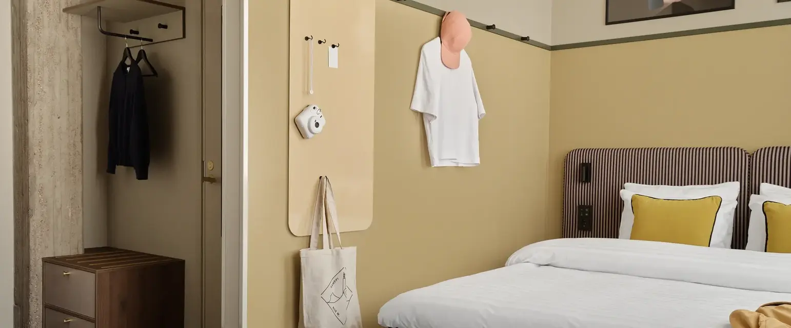 a room with a bed and a bench