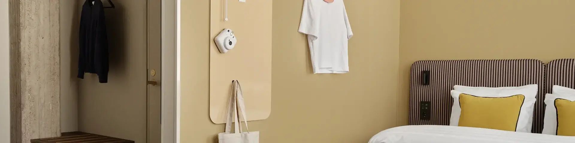 a room with a bed and a bench