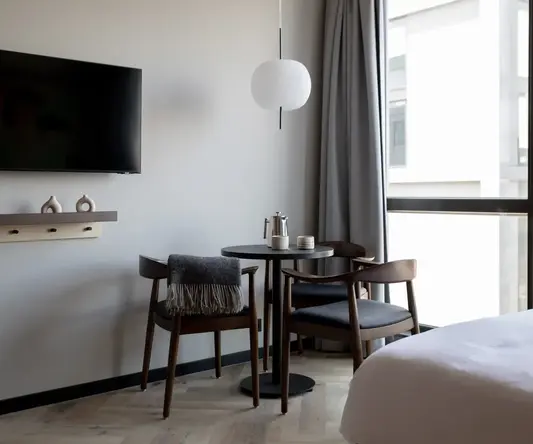 a room with a table and chairs