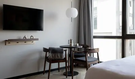 a room with a table and chairs