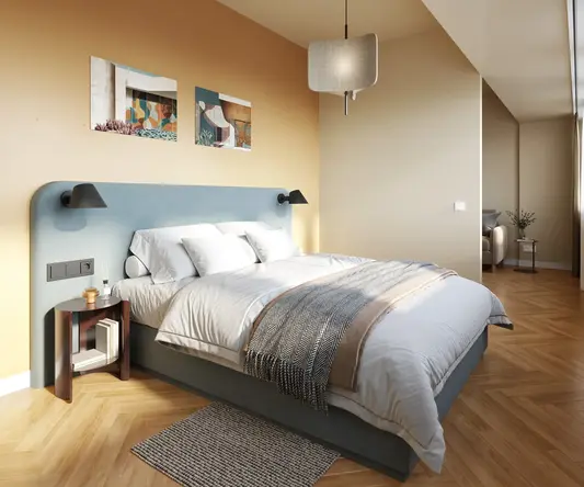 a bedroom with a bed and a lamp