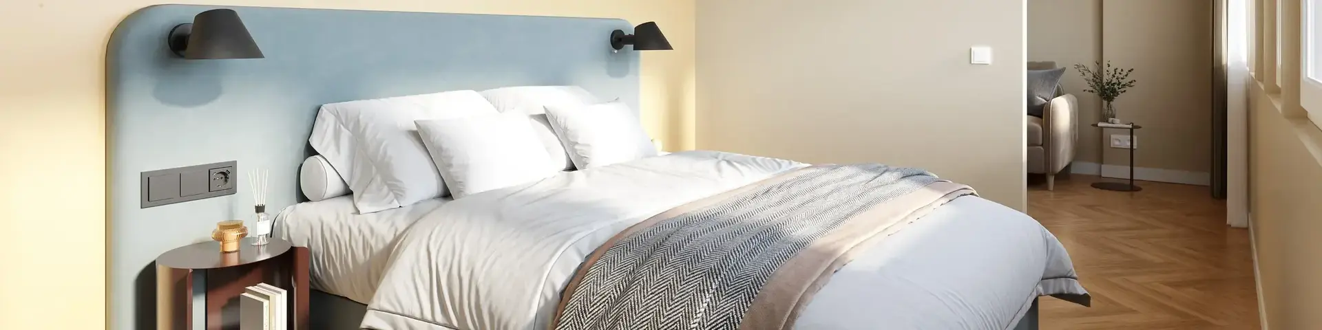 a bedroom with a bed and a lamp