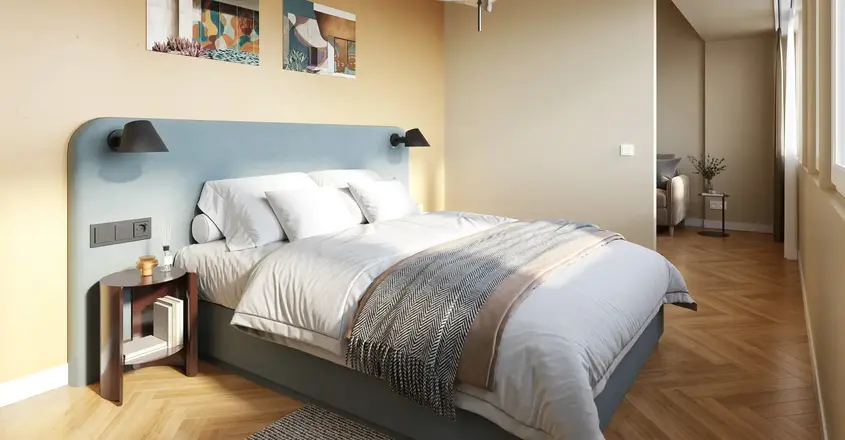 a bedroom with a bed and a lamp
