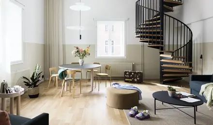 a room with a spiral staircase and a round table