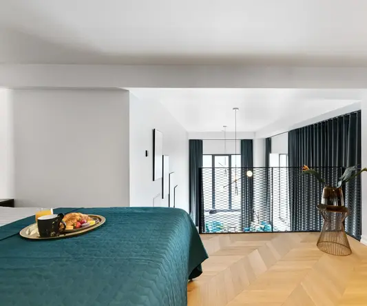 a bedroom with a bed and a basket of food