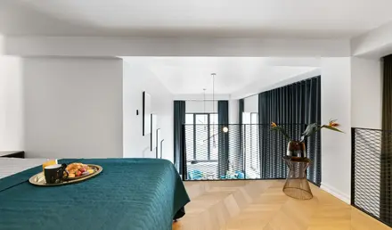 a bedroom with a bed and a basket of food