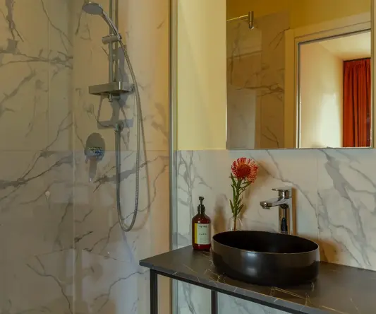 a bathroom with a sink and shower
