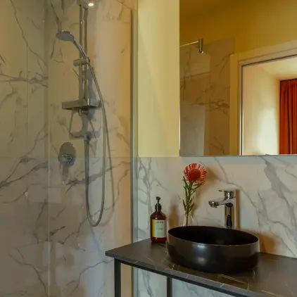 a bathroom with a sink and shower