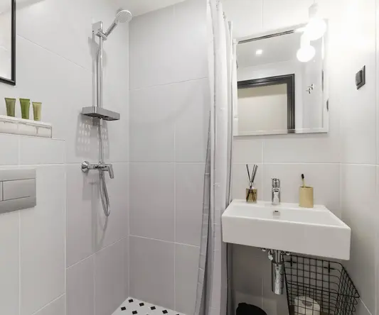 a bathroom with a shower and sink
