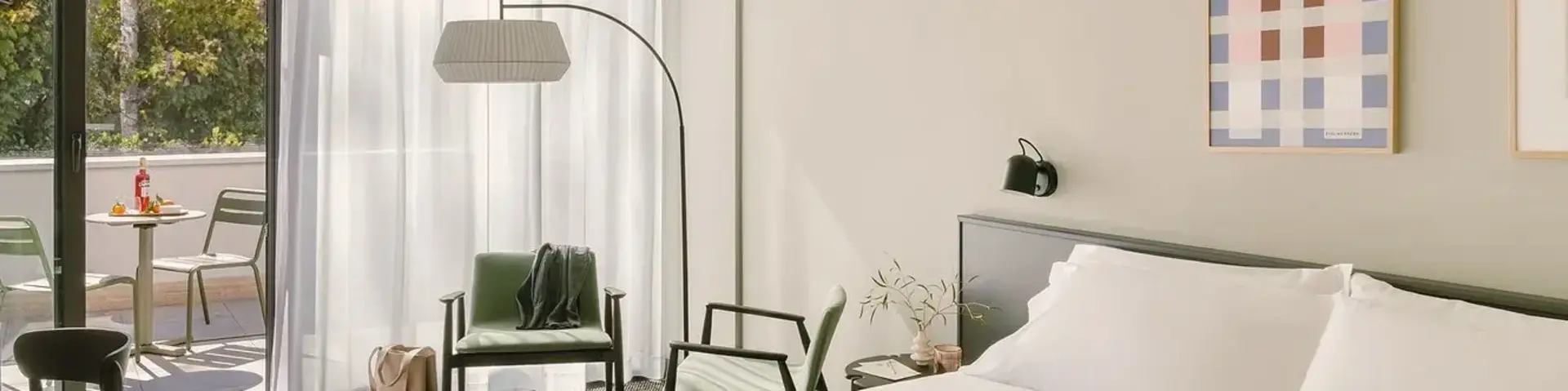 a bedroom with a bed and a chair