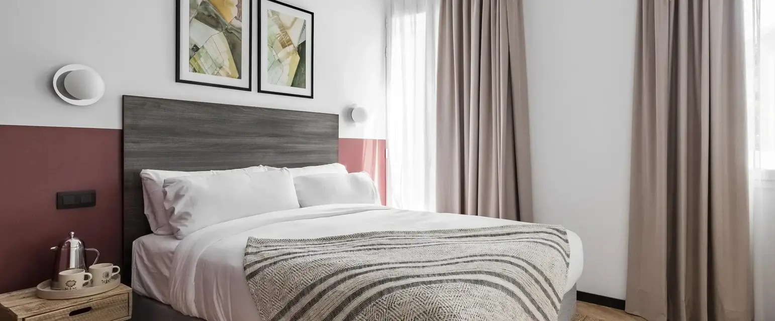 a bed with a blanket in a room