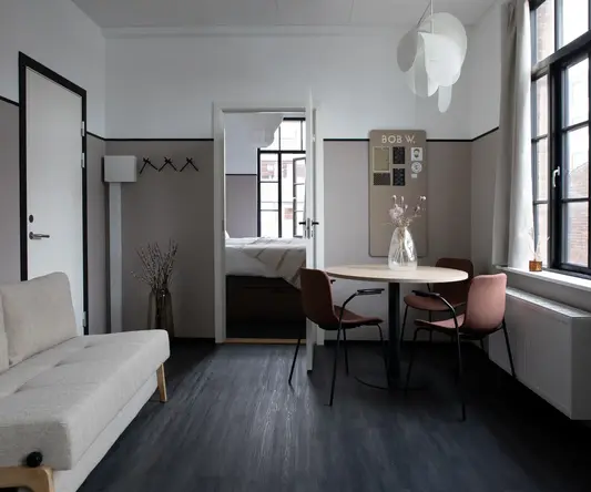 a room with a table and chairs