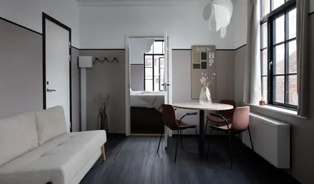 a room with a table and chairs