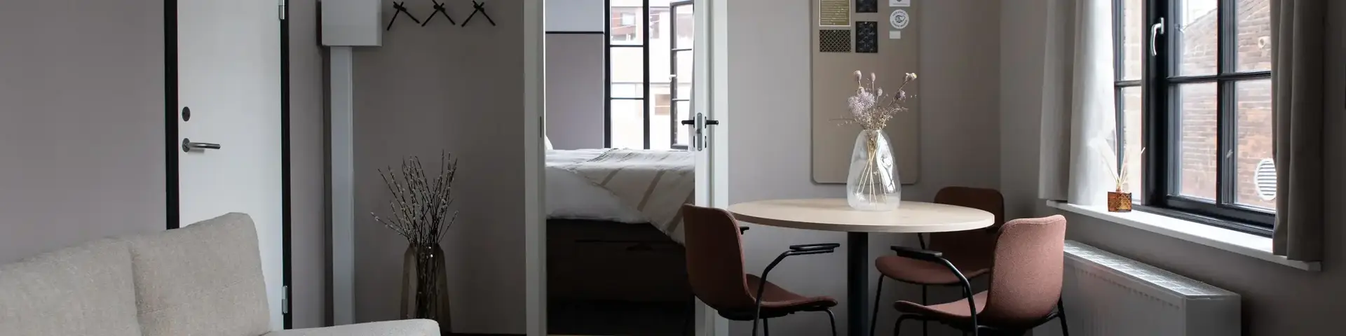 a room with a table and chairs