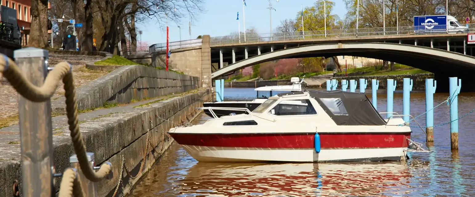 The river winds through the city, lined with cafés, terraces, and a little local life on every corner.