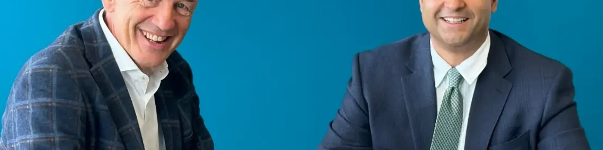 two men sitting at a table