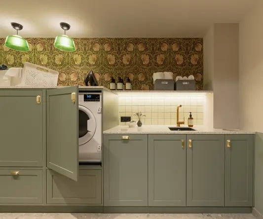 a laundry room with a washing machine