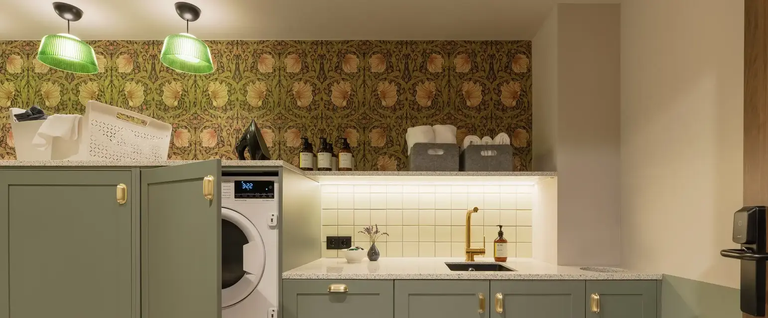 a laundry room with a washing machine