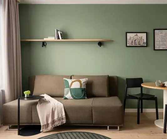 a living room with a couch and table