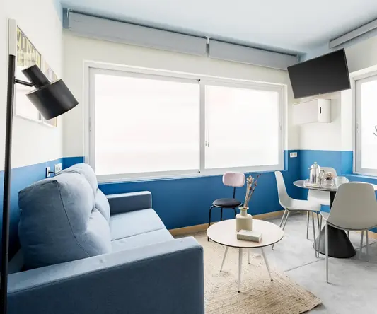 a living room with a couch and table