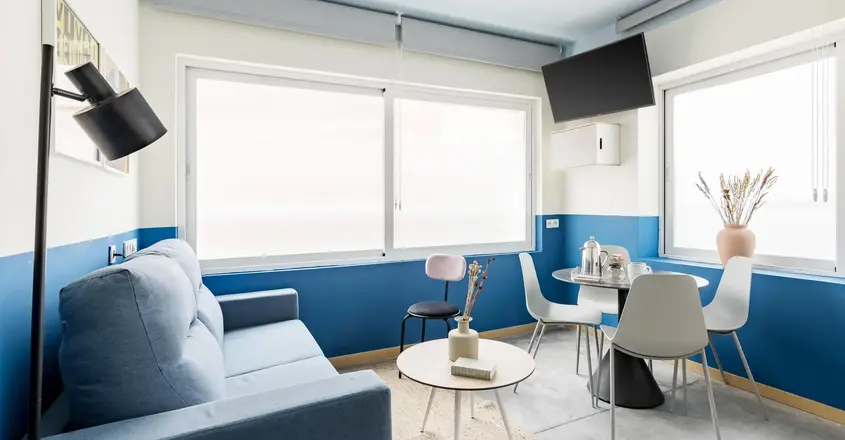 a living room with a couch and table