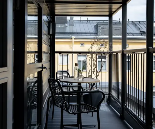 a table and chairs on a balcony