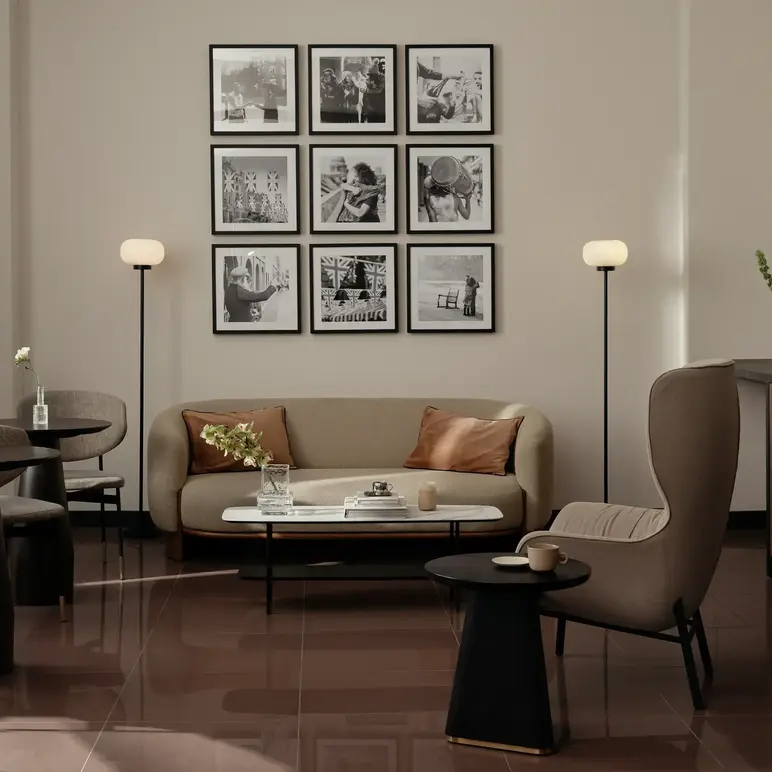 a room with a couch and chairs