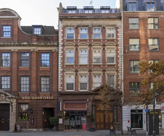 a row of buildings with a street light