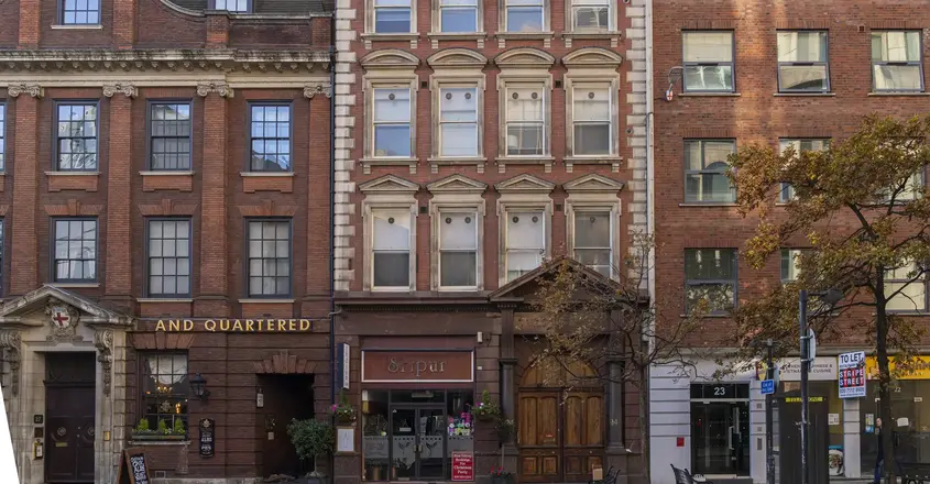 a row of buildings with a street light