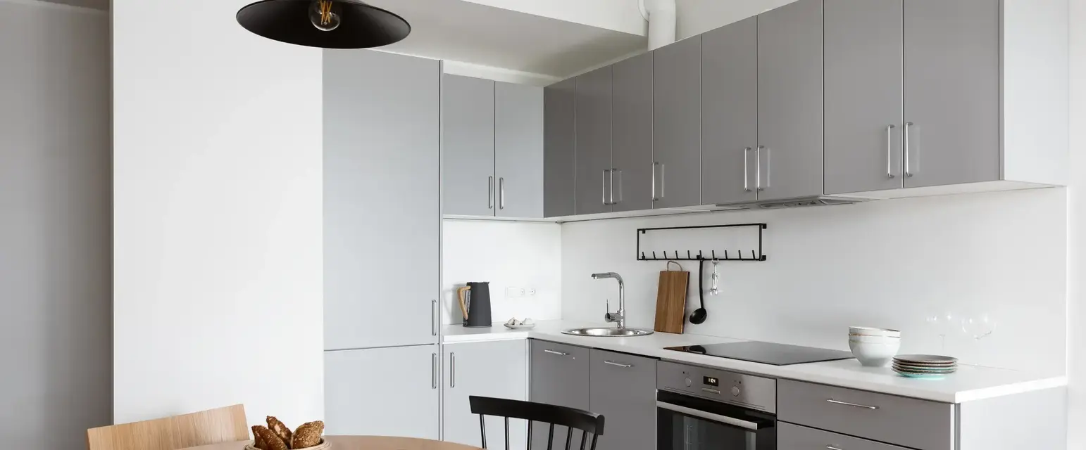 a kitchen with a table and chairs