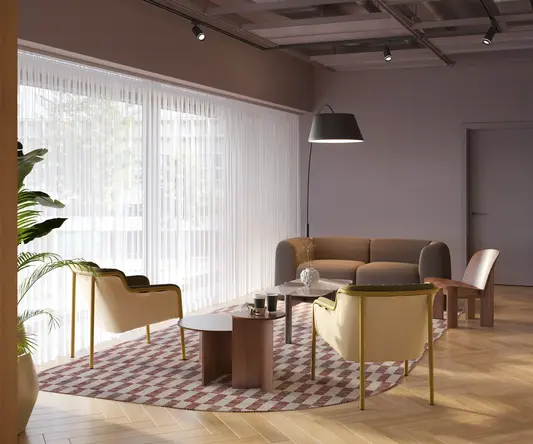 a room with a couch and chairs
