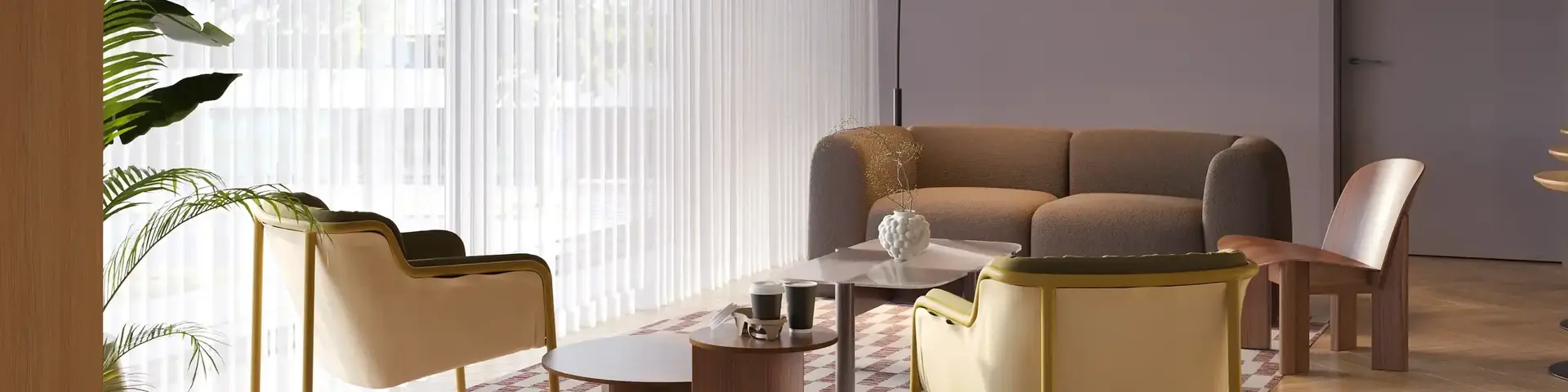 a room with a couch and chairs