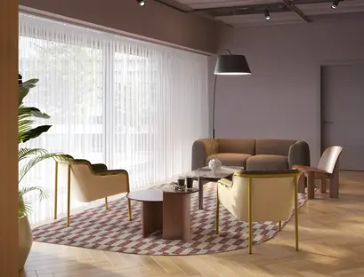 a room with a couch and chairs