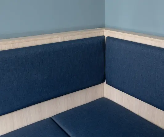 Seating area within the Bob W London Tower Hill Studios Compact Studio