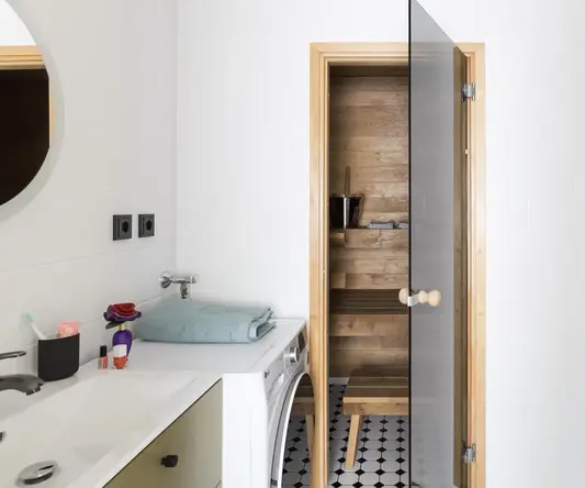 a wooden door in a bathroom