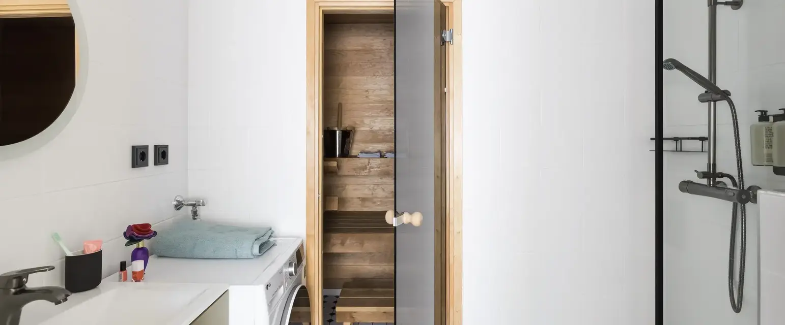 a wooden door in a bathroom