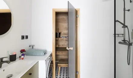 a wooden door in a bathroom