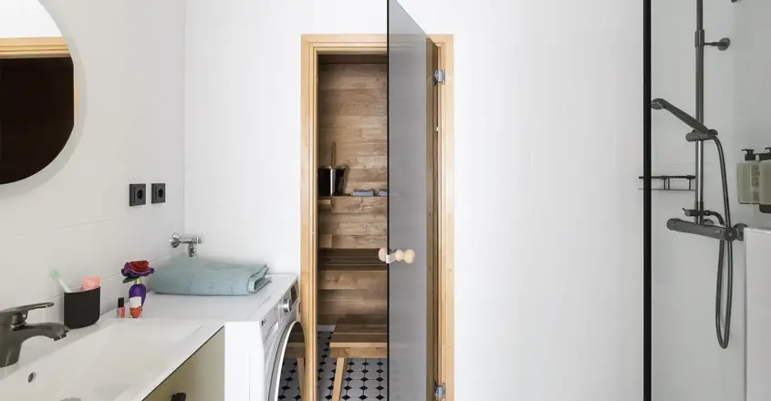 a wooden door in a bathroom