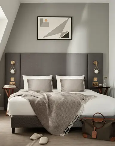 a bedroom with a bed and a desk