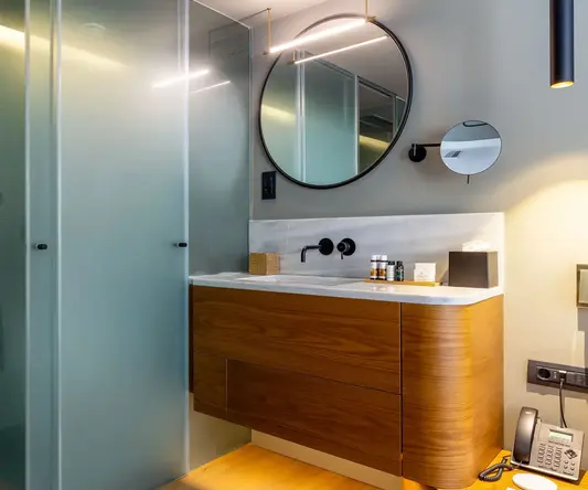 a bathroom with a mirror and sink