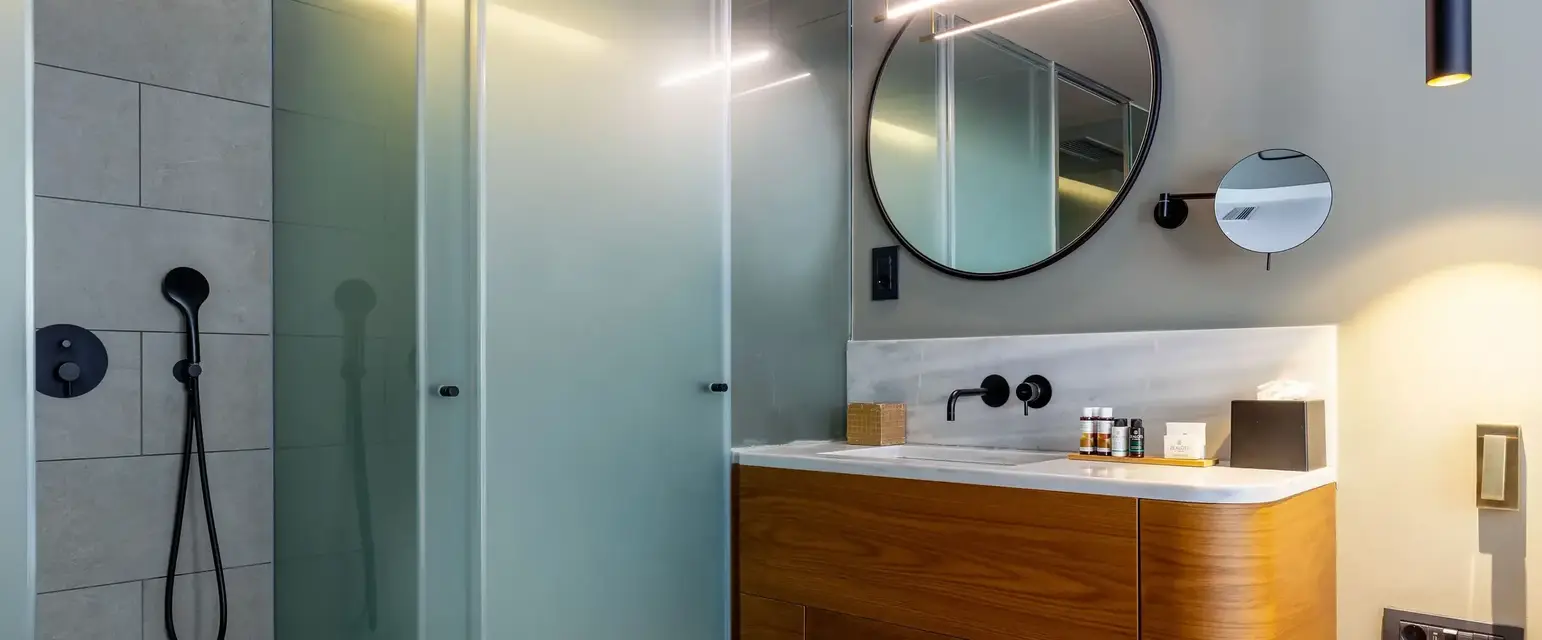 a bathroom with a mirror and sink