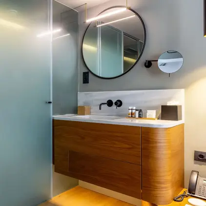 a bathroom with a mirror and sink