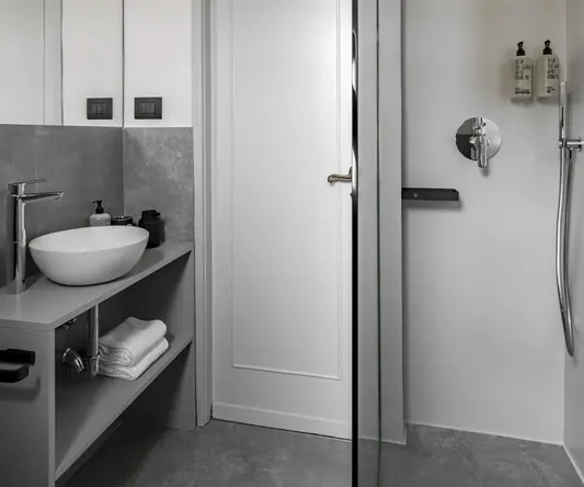 a bathroom with a shower and sink
