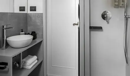 a bathroom with a shower and sink