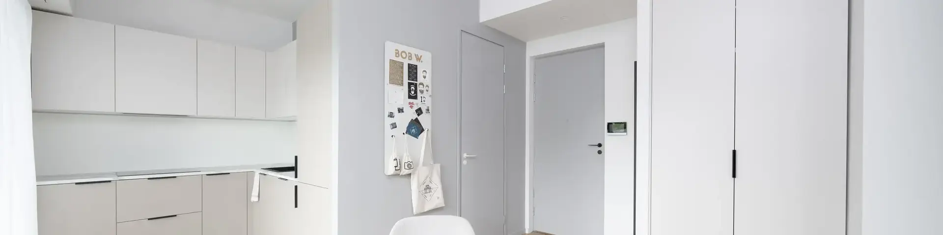 a room with a round table and chairs